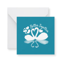 Ett par Svan Silhouette-reflektion i Vatten