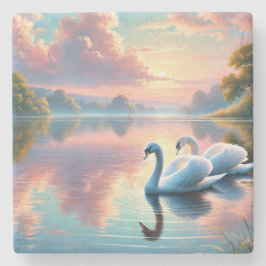 Ett par svanar glider på en serene sjö stenunderlägg