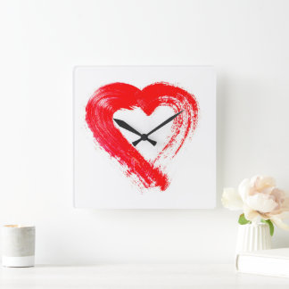 Ett rött hjärtväggslås fyrkantig klocka