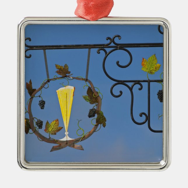 Ett skrivtecken från järn som illustrerar temat julgransprydnad metall (Framsidan)