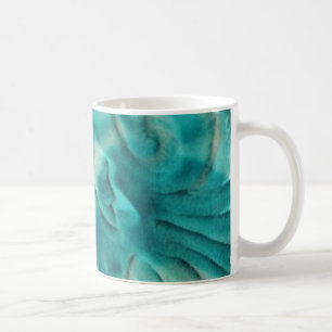 Ett snurrande mönster i teal- och ljusbeige kaffemugg