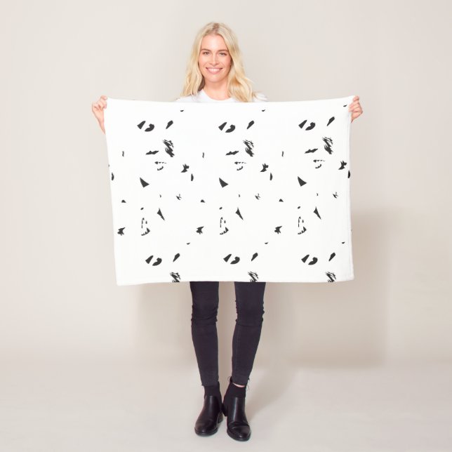 Ett svart och vitt foto av en flock fåglar fleecefilt (På plats)