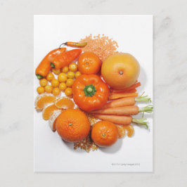 Ett urval av frukt och grönsaker av orange. vykort