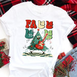 Fa La Julgran Guitar Retro T Shirt<br><div class="desc">Gå in i den festliga grooven med den här roligten och skaka Julgran-designen. Den här skjortan är perfekt för alla som kärlek kombinerar helgdag med ett litet vintage. Oavsett om du går på en jul i party, studerar hemma eller sprider helgdag glädje, ger den här unika designen en lekfull och...</div>