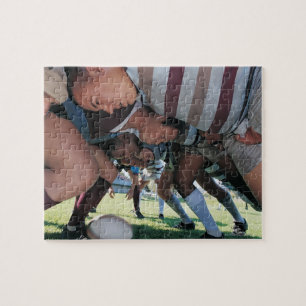 Fackliga spelare för Rugby i en Scrum Pussel