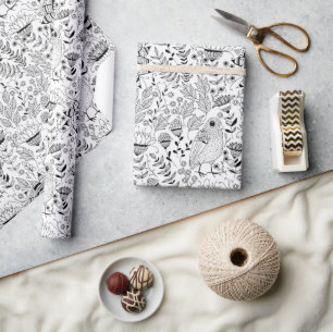 Fågel- och blomdoodle mönster som omsluter pappra presentpapper