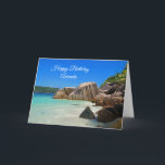 Fågeldagen i Kusten vid Tropiska havet Rocky Kort<br><div class="desc">Ett hälsningskort med ett foto av en turkotisk blå havsstrand med stort sten utspridt längs kusten. Ljus och soligt tropiskt språk.</div>