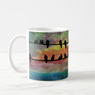 Fåglar på en binda kaffemugg