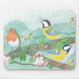 Fåglar sjunga på en blomstrande träd gren i vår musmatta