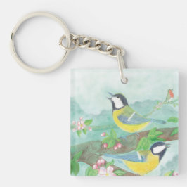 Fåglar sjunger på en blommande träd gren