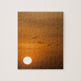 Fåglar som flyger i solnedgång pussel