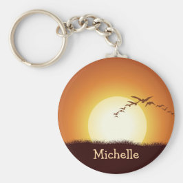 Fåglar som flyger i solnedgångskedjan för Personli Nyckelring