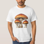 Fairytale Fungi: A Cluster of Red Toadstools T Shirt<br><div class="desc">This high-quality illustration features a cluster of three Amanita muscaria mushrooms at various stages of growth. The central, largest mushroom showcases a broad, flattened cap with a vibrant orange-red gradient and distinctive white "warts, " which are remnants of its universal veil. Flanking it are two smaller, more convex specimens. All...</div>