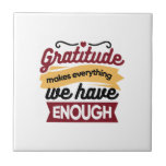 Faith and Gratitude Artwork – Uplifting Christian  Kakelplatta<br><div class="desc">Celebrate the power of gratitude with this inspirational Christian quote: 'Gratitude makes everything we have enough.' A beautiful faith-based design for decor,  apparel,  and gifts. #Thankfulness #Grateful</div>