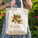 Fall botaniskt bouquet bridesmaid namn tygkasse<br><div class="desc">Modern rustik brud till påsgåva med rostande orange guld och blommor av elfenbensgrädde med torkat löv och bladverk och ett typografiskt manus av vismisk chic.           Anpassa det med namn på framsidan och med bröllop parets namn och datum på motsatt sida.</div>
