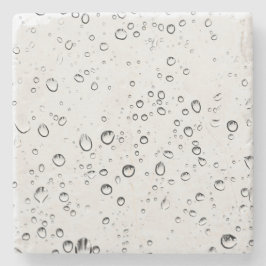 Fallande regndroppar stenunderlägg