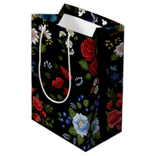 Falska broderade röda och blå blommor