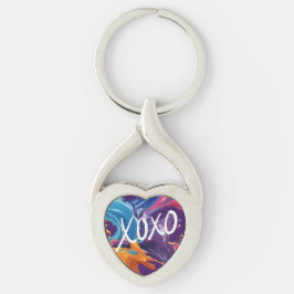 Färgämnet XOXO- Twisted Heart Silverfärgad Nyckelring