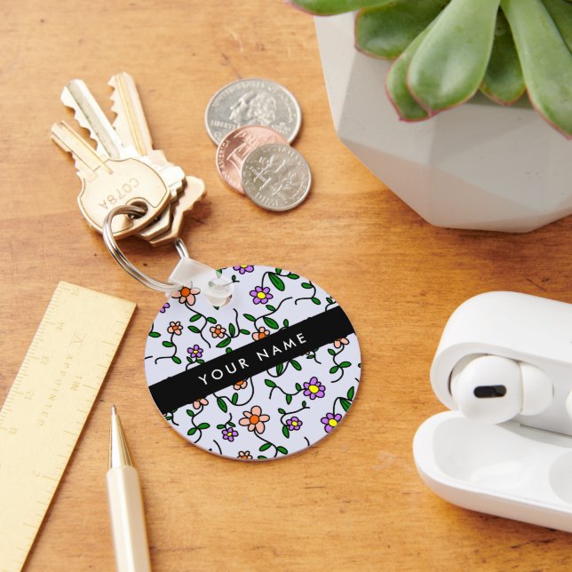 Färgblommor, blå bakgrund, svart nyckelring (Skrivbord)