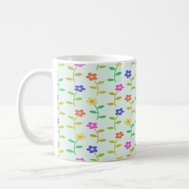 Färgblommor på grönten blek kaffemugg (Vänster)