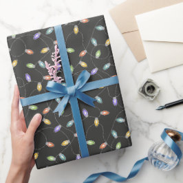 Färgfläckad ljus garland mönster på svart presentpapper