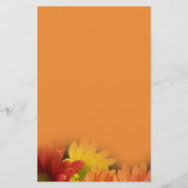 Färgfläckar, gult och daisy av orange. brevpapper