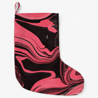 Färgfläckig rödmarmor bläck pappra struktur på vit liten julstrumpa