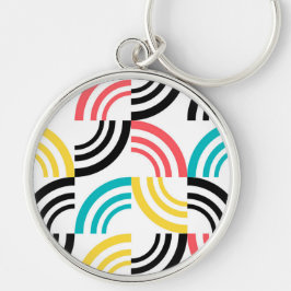 Färgfull, modern, roligt, sansad geometrisk grafik rund silverfärgad nyckelring