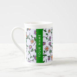 Färgglada blommor, blå bakgrund, grön benporslin mugg