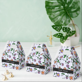 Färgglada blommor, blå bakgrund, svart presentaskar