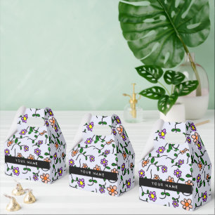 Färgglada blommor, blå bakgrund, svart presentaskar