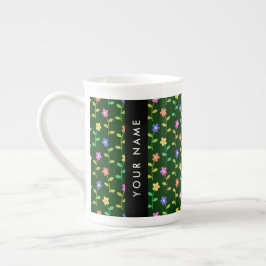 Färgglada blommor, grön bakgrund, svart benporslin mugg
