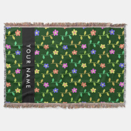 Färgglada blommor, grön bakgrund, svart filt