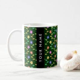 Färgglada blommor, grön bakgrund, svart kaffemugg