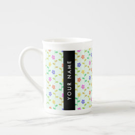 Färgglada blommor, ljusgrön bakgrund, svart benporslin mugg