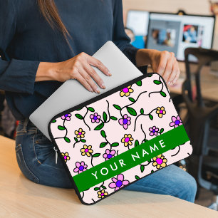 Färgglada blommor, rosa bakgrund, grön laptop fodral