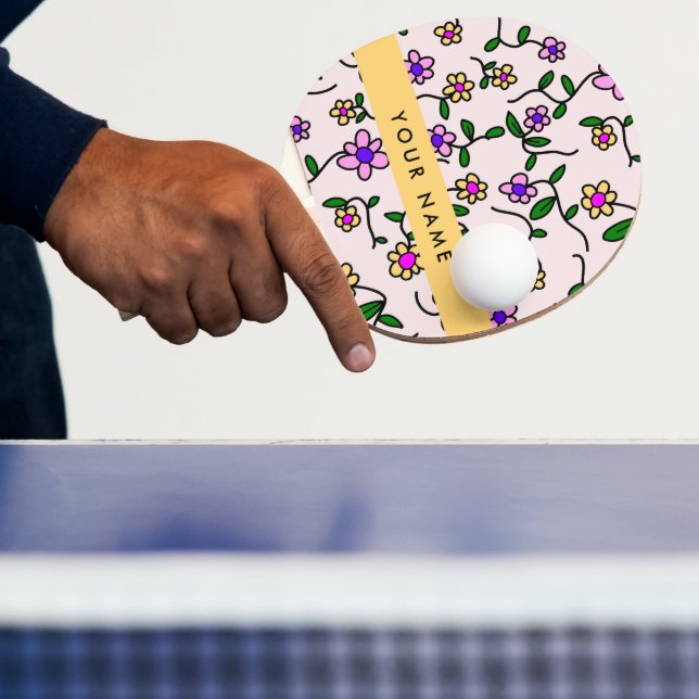 Färgglada blommor, rosa bakgrund, gul pingisracket (Insitu)