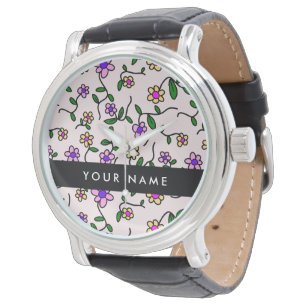 Färgglada blommor, rosa bakgrund, svart armbandsur