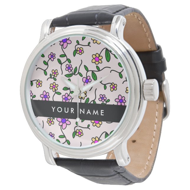 Färgglada blommor, rosa bakgrund, svart armbandsur (Vinklad)