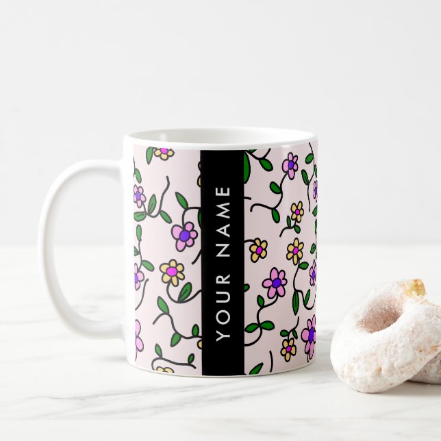 Färgglada blommor, rosa bakgrund, svart kaffemugg (Med munk)