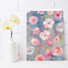 Färgglada rosa vårblommor på nyanser av blått kort