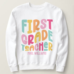 Färgrik textdesign för lärare i första klass t shirt