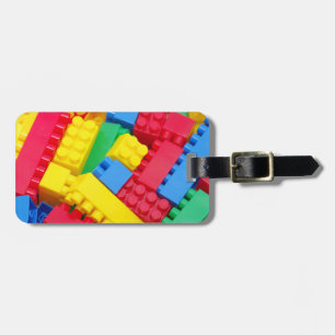 Färgrika bygga kvarter bagagebricka