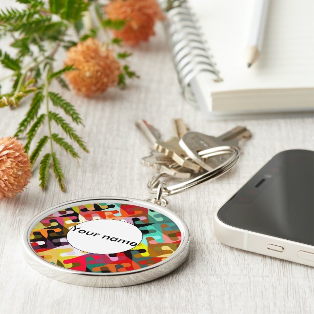 Färgstarka former abstrakt design rund silverfärgad nyckelring (Sidan)