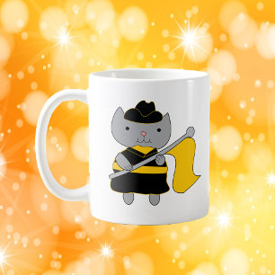 Färgväktarkatt svart och gul guld kaffemugg