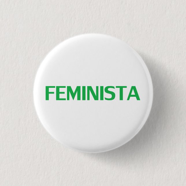 Feministen, feminist i spansk grönt, vit modern knapp (Framsida)