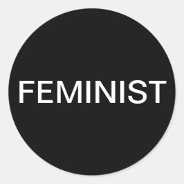 Feministisk, fetstil, vit text på svarta klistermä runt klistermärke
