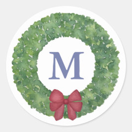 Festiv monogramutandning med grön andedräkt med rö runt klistermärke