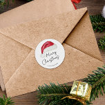 Festive Minimal Santa Hat Cute Whimsical jul Runt Klistermärke<br><div class="desc">Denna minimala märkre för "God jul"-gåva har en hand plockade-tomtehatt som tillför en aning nostalgiskt stollig. Originalkonst av Malissa Melrose.</div>