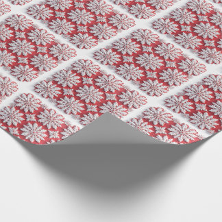 Festivt mönster av röda och vita snöflingor presentpapper
